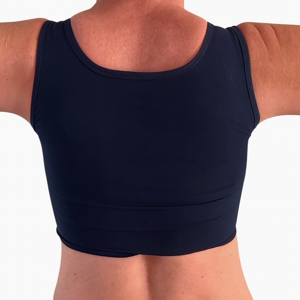 Chest compression – compresión torácica, Breast binding – compresión mamaria, Chest binding – compresión del pecho, Chest bandaging – vendaje del pecho, Breast reduction – reducción mamaria, Chest binding – compresión del pecho, Breast binding – compresión mamaria, Chest compression – compresión torácica, Breast flattening – aplanamiento del pecho, Chest bandaging – vendaje del pecho, Chest binder – binder de pecho, Trans binder – binder trans, FTM binder – binder FtM, Compression top – top de compresión, Chest binder – binder de pecho, Chest compressor – compresor de pecho, Binder trans – binder trans, Binder bra – sujetador compresor, Chest binder FTM – binder FtM, Compression top transgender binder – top compresor para personas transgénero